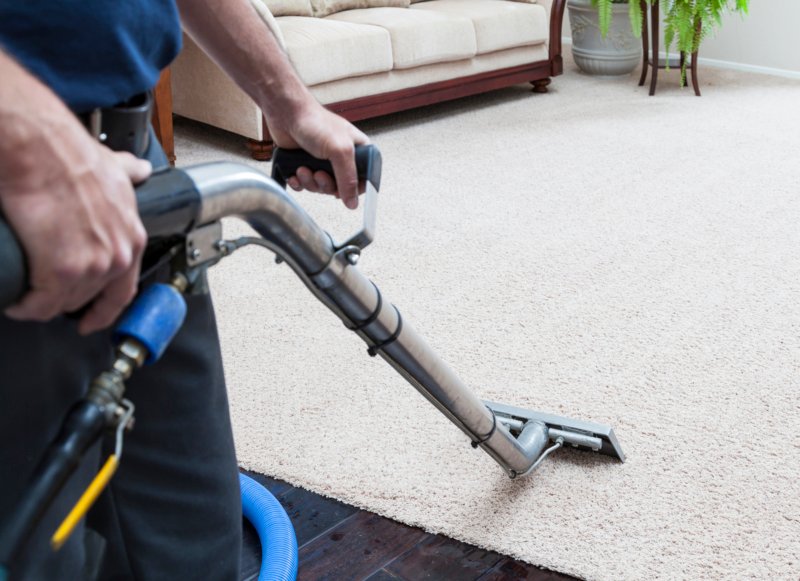 Carpet Clinic of Orlando steam cleaning a living room carpet